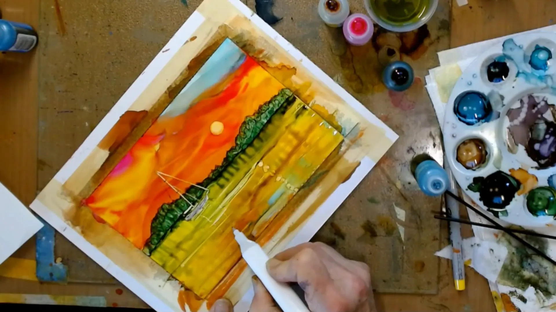 Refining the details of the sailboat in the alcohol ink painting